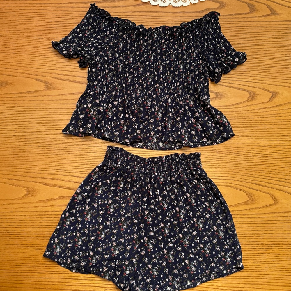 Navy short set with floral pattern.